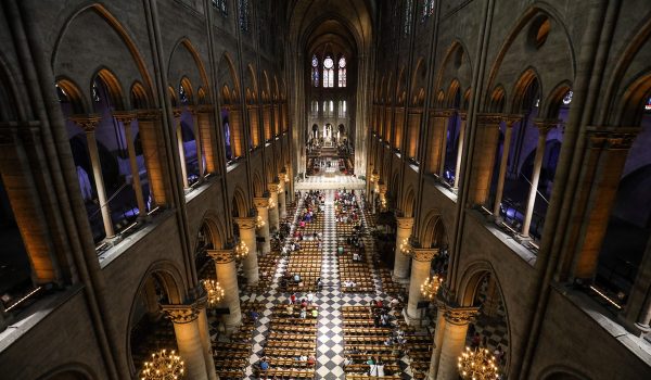 TOPSHOT - This photograph taken on June 26, 2018, shows worshippers as they arrive to take part in a mass at Notre Dame de Paris Cathedral in Paris. (Photo by Ludovic MARIN / AFP)        (Photo credit should read LUDOVIC MARIN/AFP/Getty Images)
